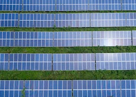 Aerial shot of a solar panel array generating renewable energy in Trenton, Georgia.